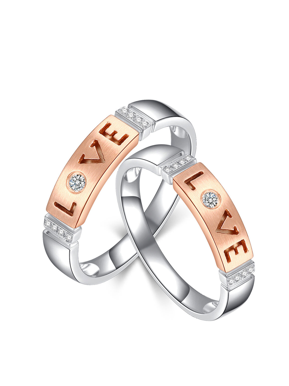 Two-tone rose gold and silver matching wedding ring engraved LOVE letter with tiny CZ accent, clean white backdrop romantic couple band commercial photography, wedding promise jewelry high-def studio portfolio photo
